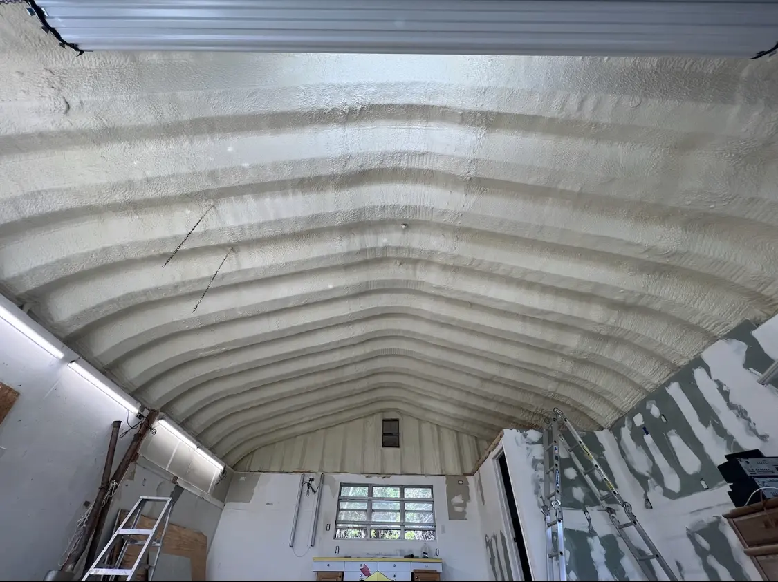 Spray polyurethane foam applied to the underside of a metal roof deck in Marrero